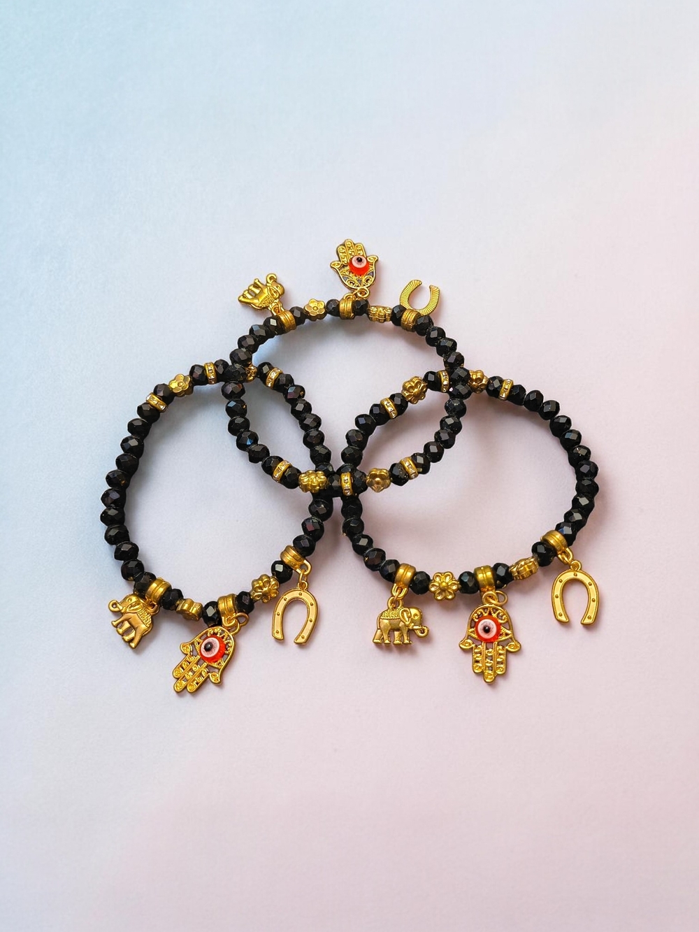 Set of 3 Black Beaded Stretch Bracelets Gold Tone Charms Evil Eye Elephant